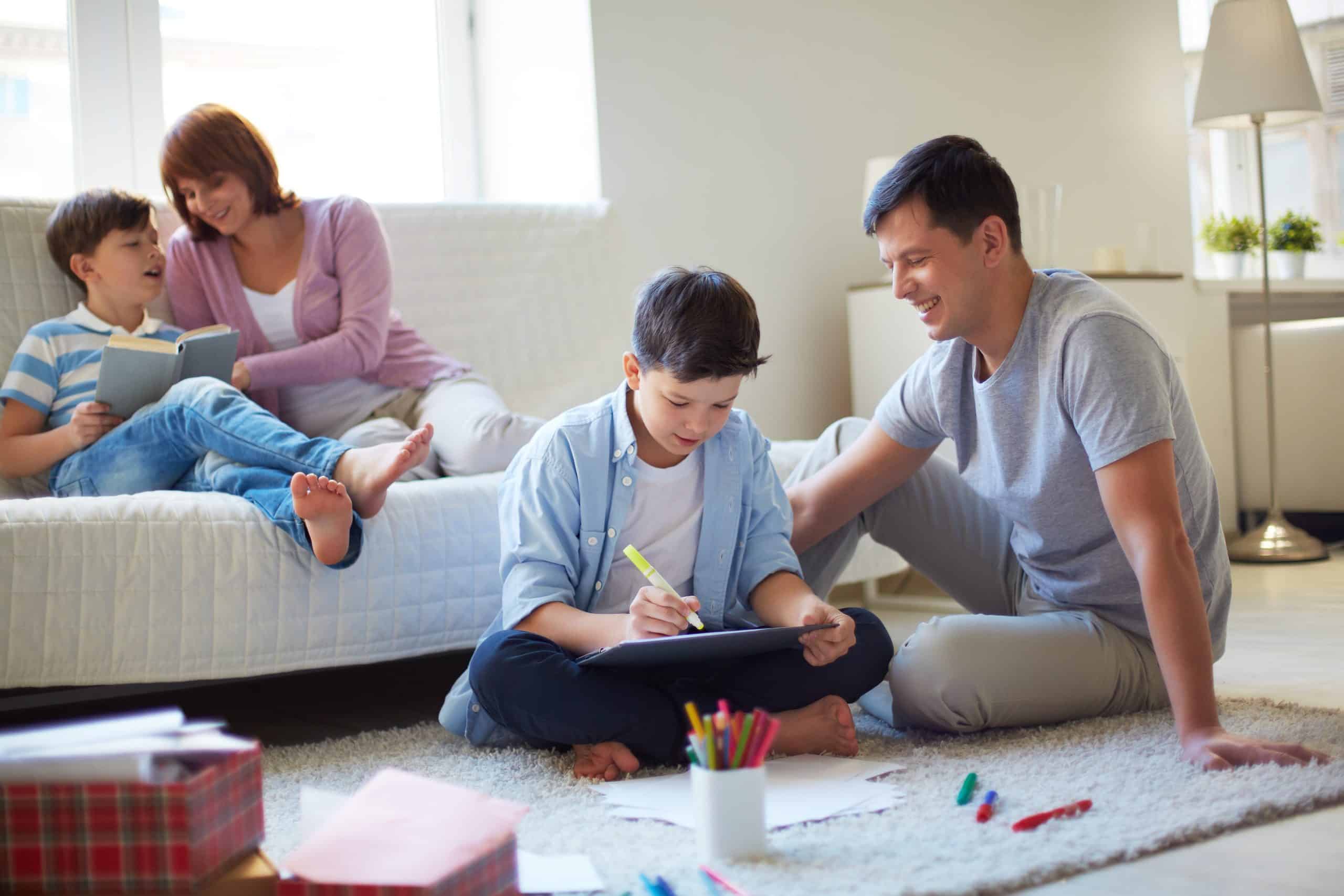 Portrait of friendly family spending leisure together at home