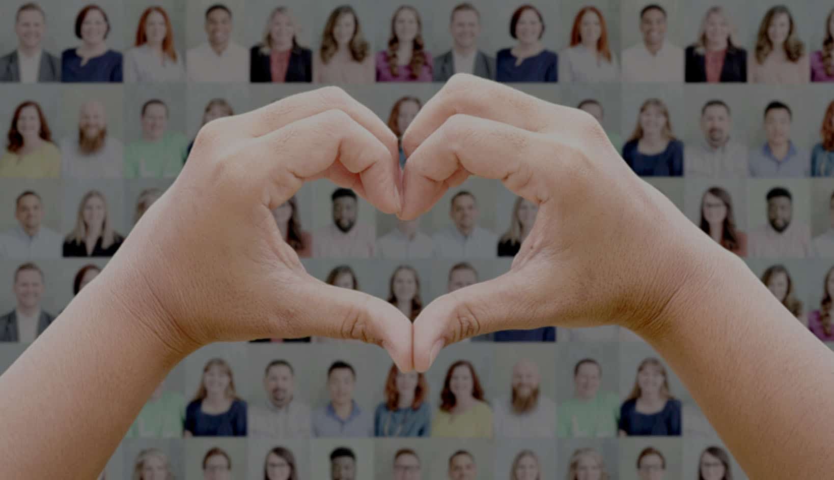 Hands in heart shape over images of eLuma employees