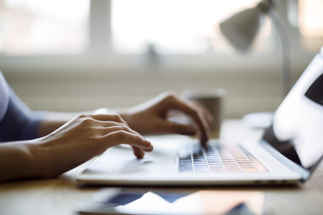 Woman using her laptop for work