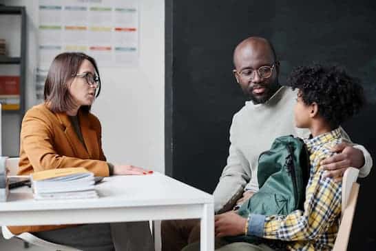 teacher meeting with parent and student